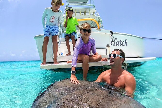 Private Charter 34ft Express Cruiser Stingay City Reef Snorkeling - Starfish Point: a 30-minute beach stop with sea stars right there